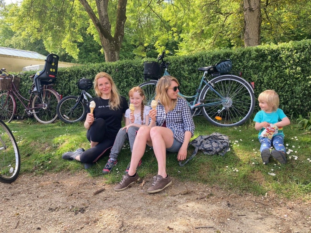 Photo of Becky with recipients of donated bikes for Ukrainian refugees