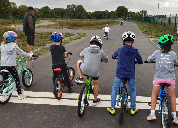 Photo of children learning to ride Ta Moredon cycle track